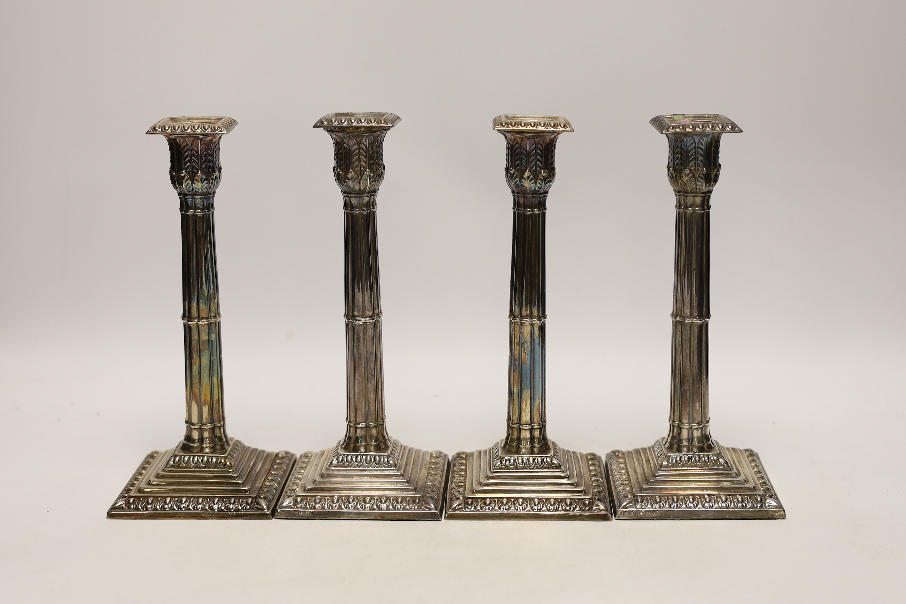 A set of four late Victorian silver cluster column candlesticks, Atkin Brothers, Sheffield, 1894, height 21.6cm, weighted.